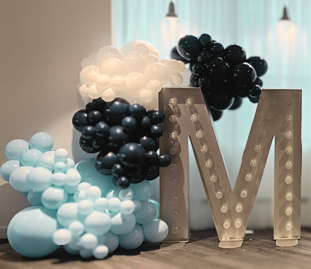 Balloon Cluster Display with Illuminated “M” Marquee Letter